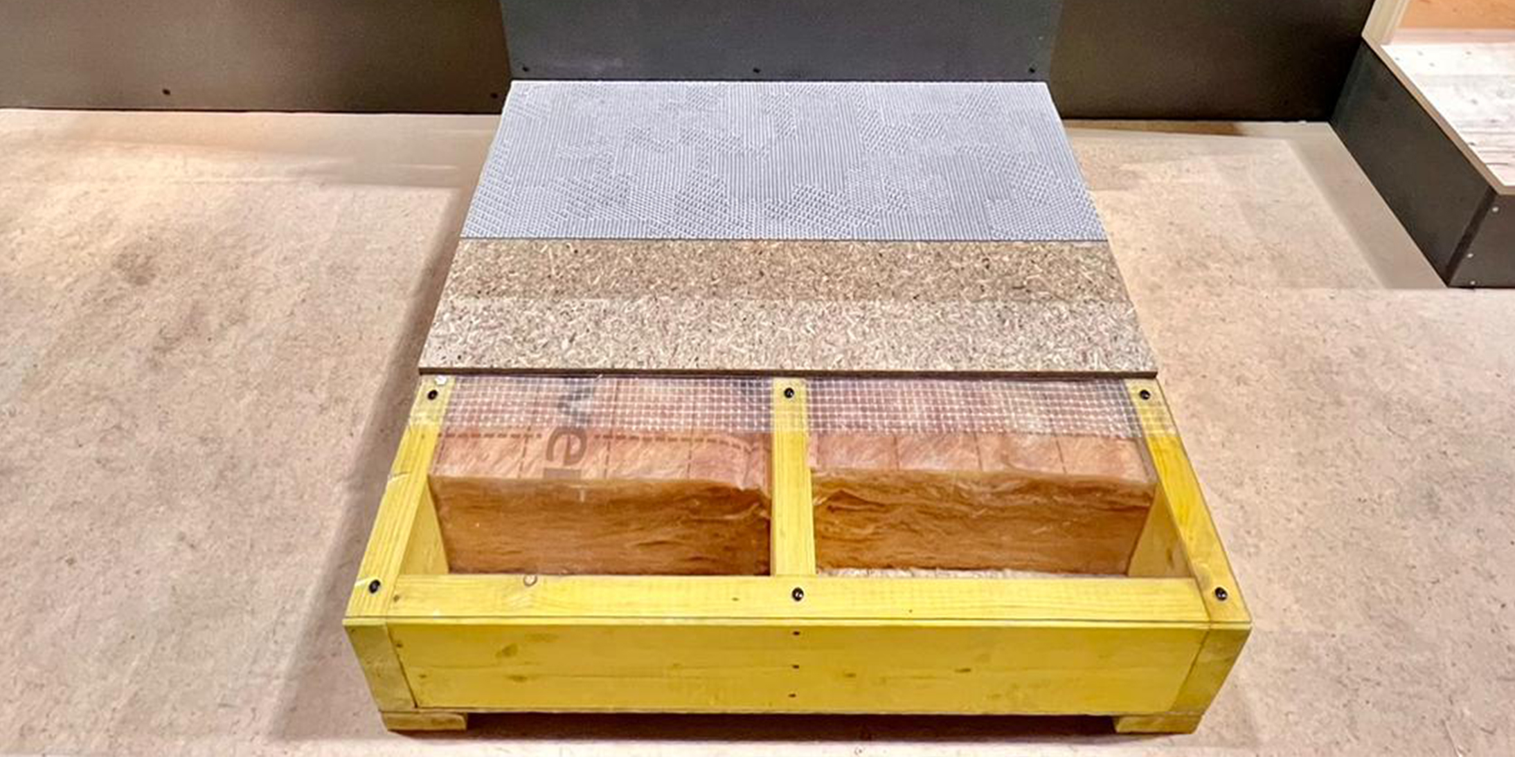 Eclaté d’un plancher et d’un mur ossature bois sur le stand GA Smart Building au Sibca 2022.